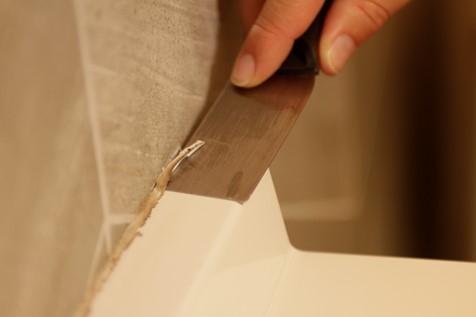 remove loose caulk