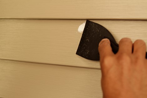 How does one repair, fix or patch vinyl siding?