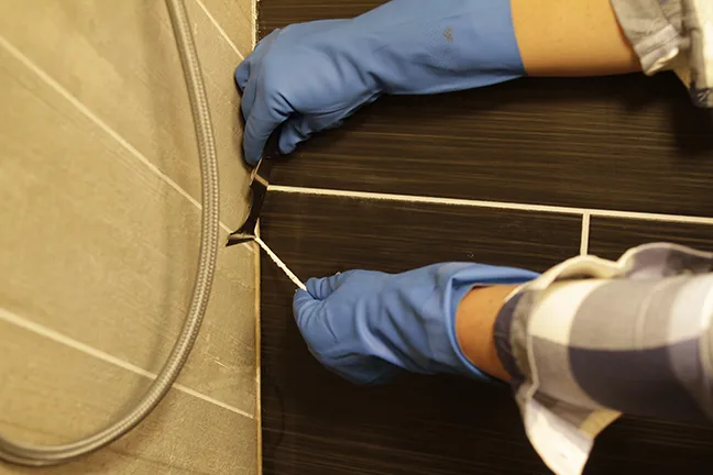 removing old sealant from shower